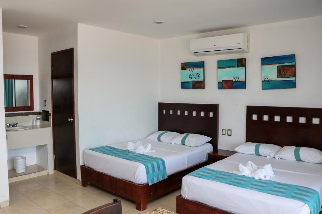Postel nebo postele na pokoji v ubytování Playa Linda Hotel