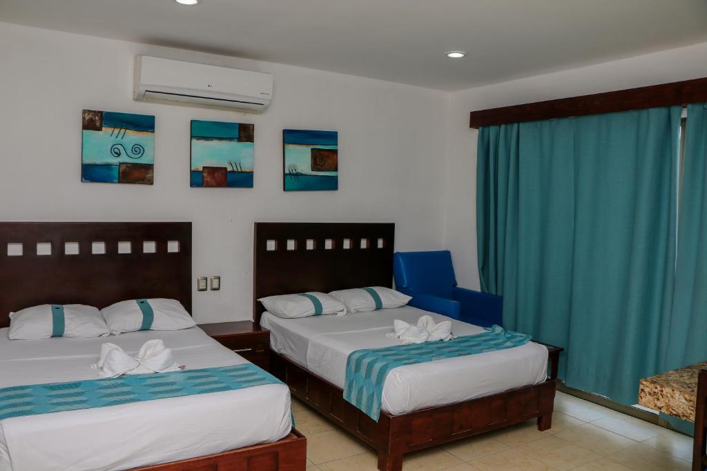 Postel nebo postele na pokoji v ubytování Playa Linda Hotel