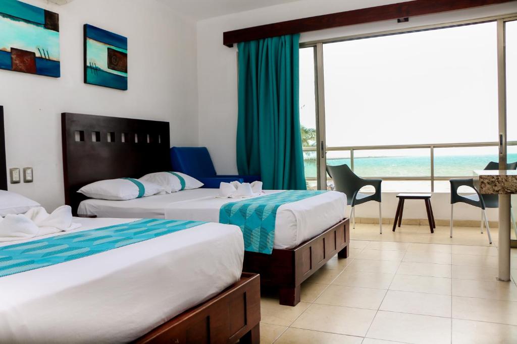 Postel nebo postele na pokoji v ubytování Playa Linda Hotel
