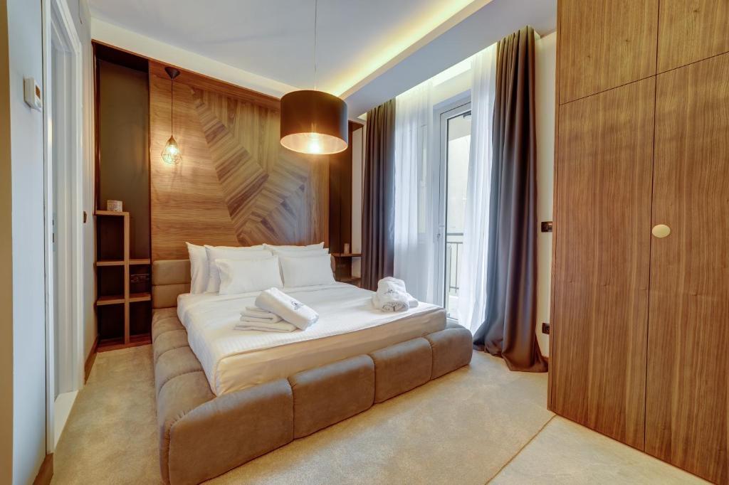 Postel nebo postele na pokoji v ubytování Black Pearl Luxury Suites