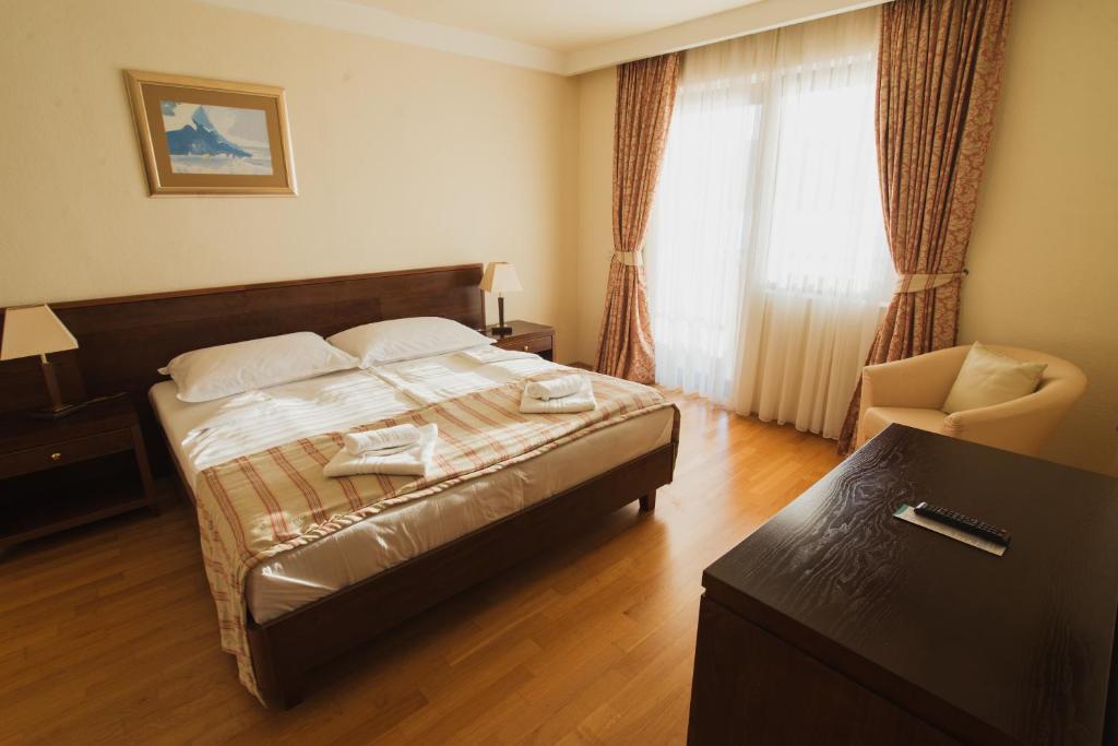 Postel nebo postele na pokoji v ubytování Family Hotel Pagus - All Inclusive