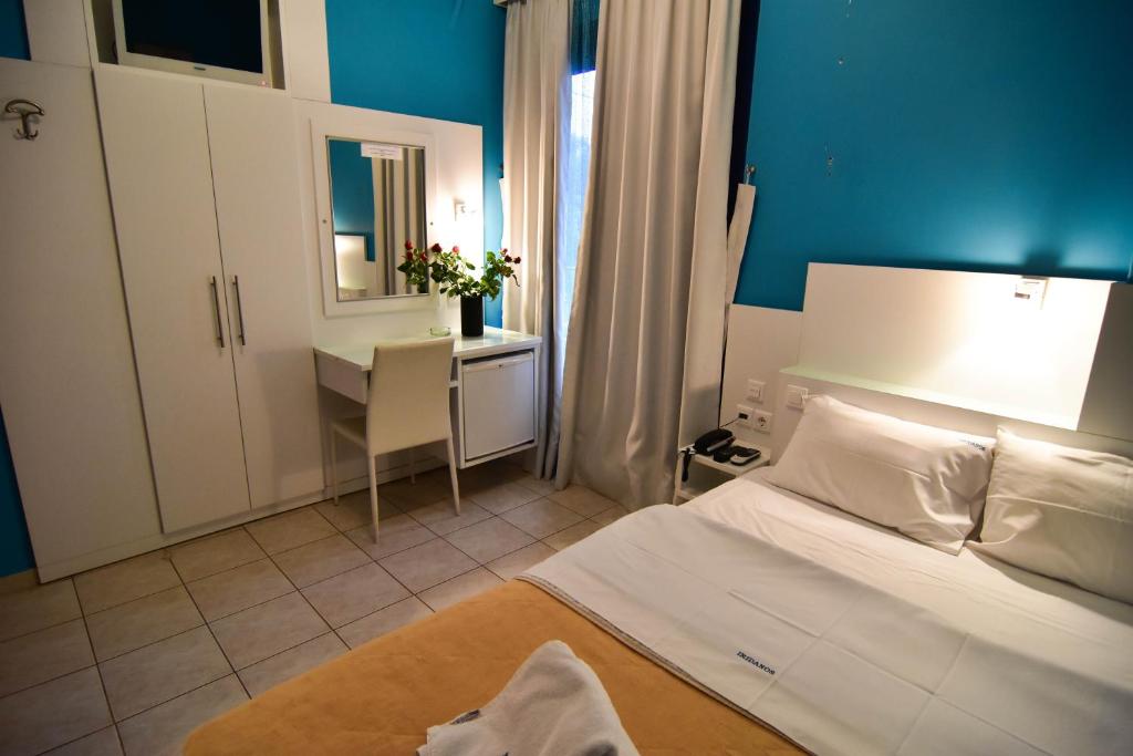 Postel nebo postele na pokoji v ubytování Iridanos