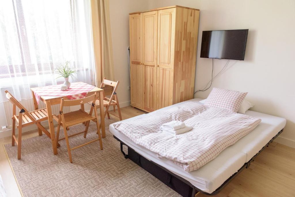Postel nebo postele na pokoji v ubytování Žltý Dom