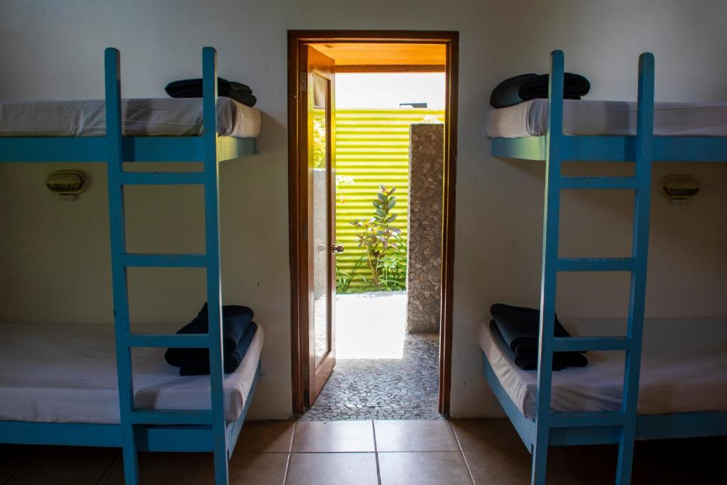 Postel nebo postele na pokoji v ubytování Beachouse Resort