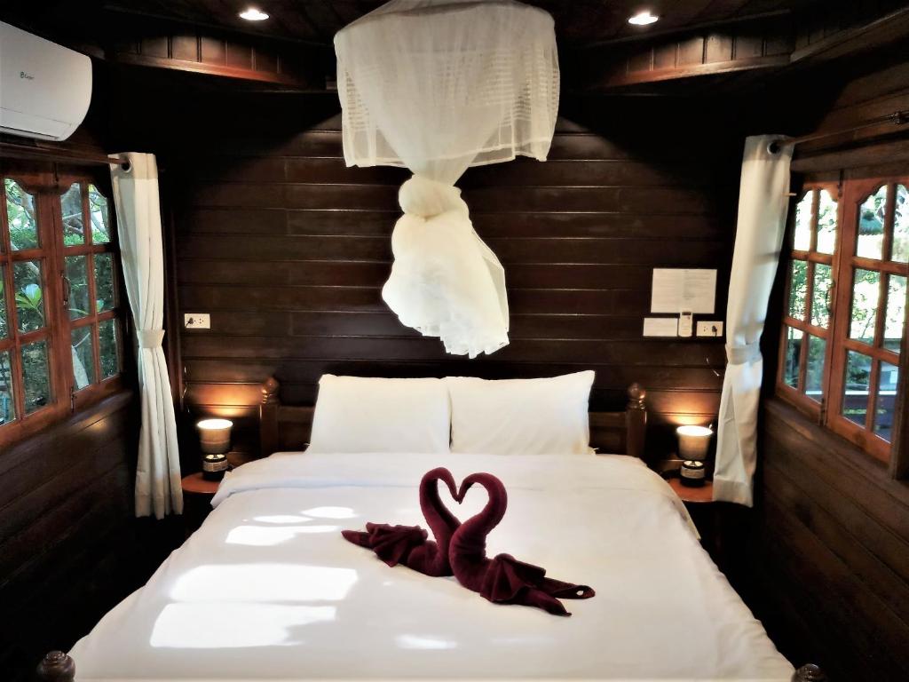 Postel nebo postele na pokoji v ubytování Cozy Garden Resort