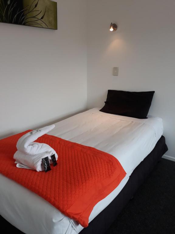 Postel nebo postele na pokoji v ubytování Mokau Motels