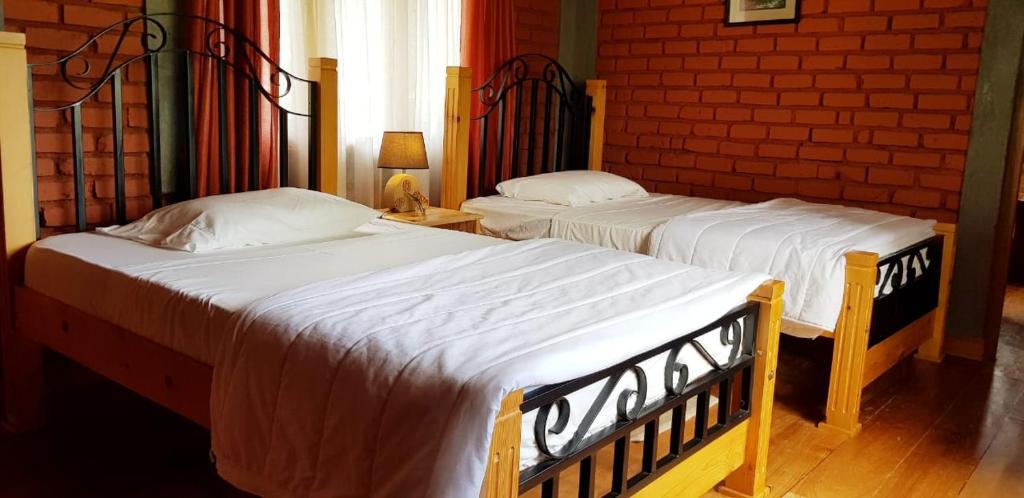Postel nebo postele na pokoji v ubytování Tea Leaf Retreat