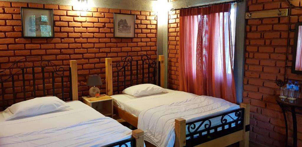 Postel nebo postele na pokoji v ubytování Tea Leaf Retreat