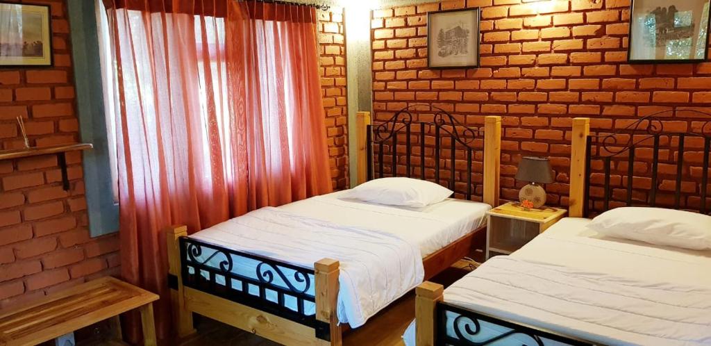 Postel nebo postele na pokoji v ubytování Tea Leaf Retreat