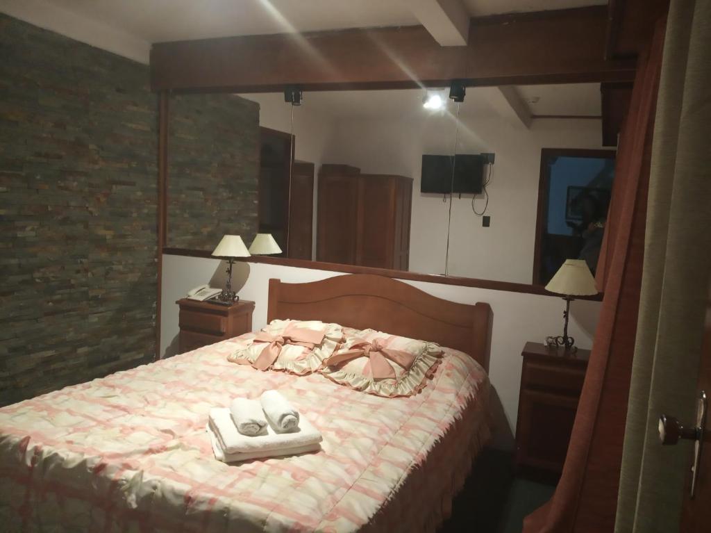 Postel nebo postele na pokoji v ubytování Wiener Haus Hotel
