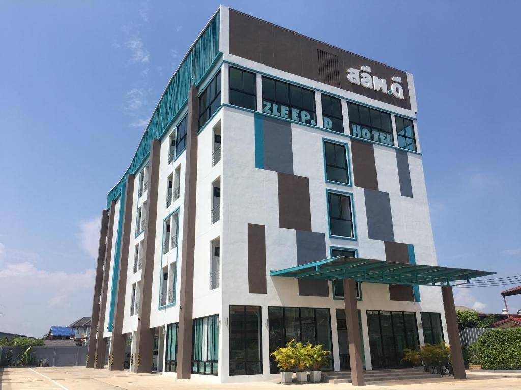 a building with a sign on the side of it at Zleep D Hotel in Udon Thani