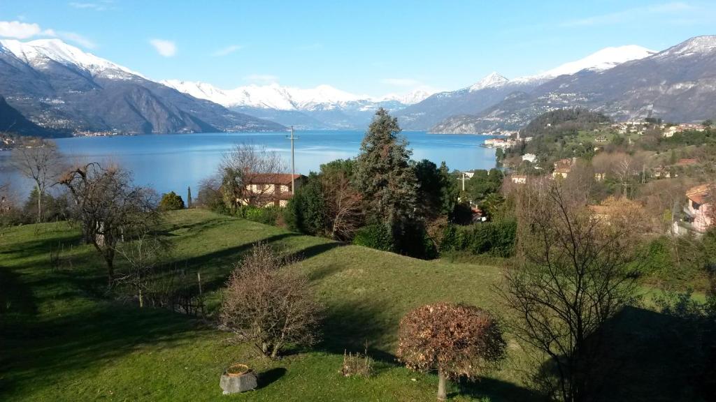 a view of a lake with mountains in the background at Casa del Faggio Rosso in Bellagio