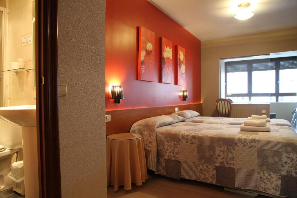 Postel nebo postele na pokoji v ubytování Hostal Acella