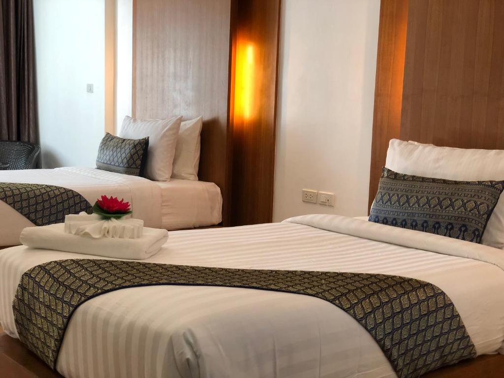 Rúm í herbergi á Phi Phi Villa Resort