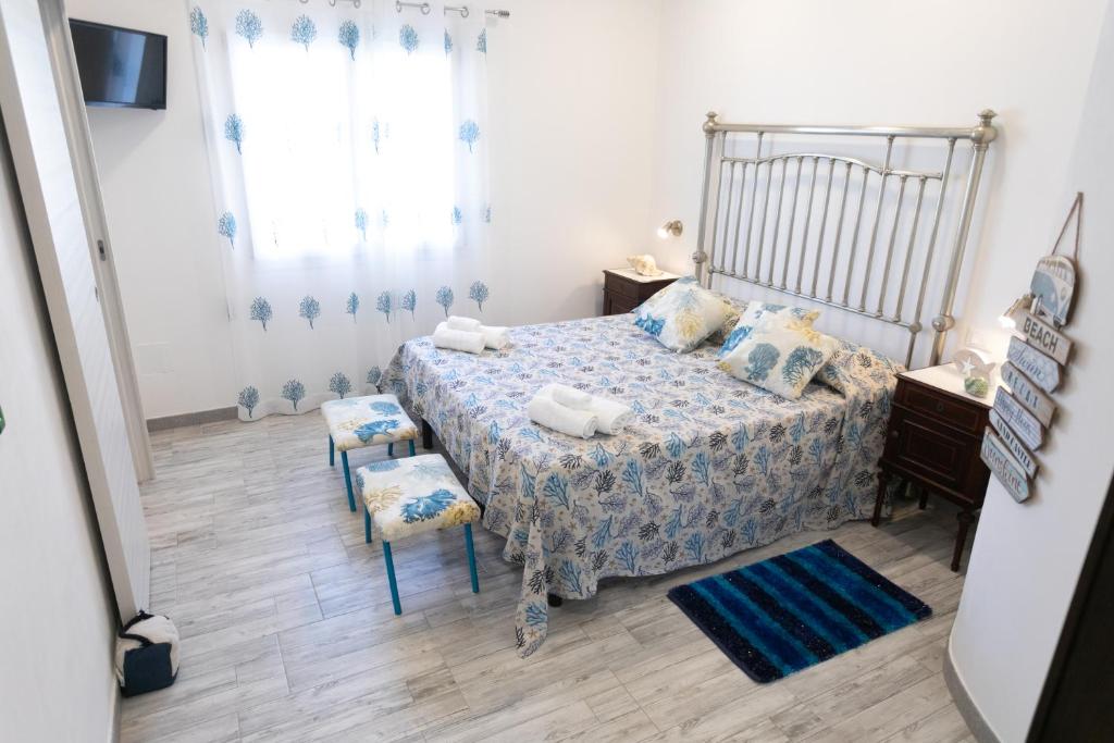 Postel nebo postele na pokoji v ubytování Edysìo mare
