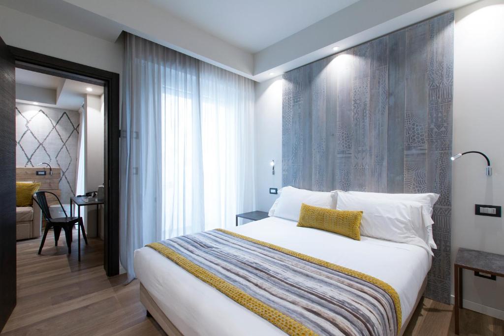 Łóżko lub łóżka w pokoju w obiekcie Hotel Dory