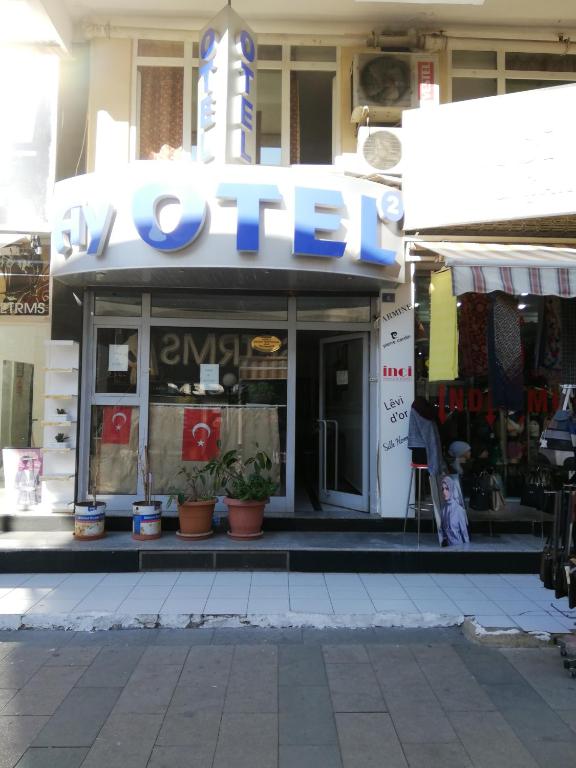 a store with a sign on the front of it at AY OTEL 2 in Antalya