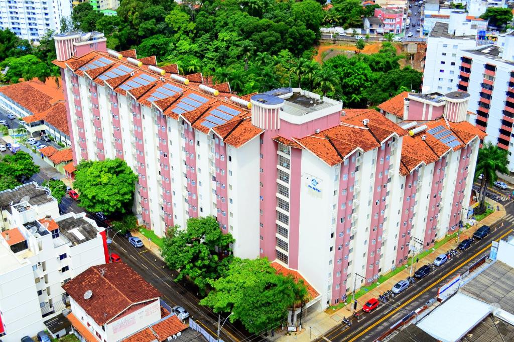 an overhead view of a large white building with a red roof at Suites Hotsprings - Caldas Novas in Caldas Novas