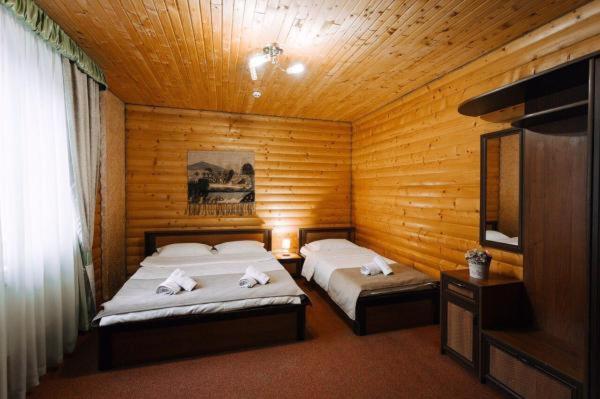 Postel nebo postele na pokoji v ubytování Hotel Marilen