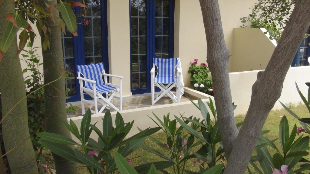 two blue and white chairs on a porch at Blue Sky in Frangokastello