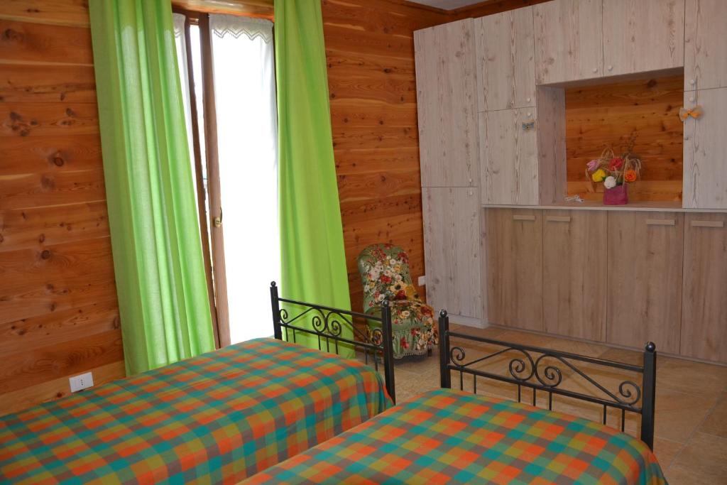 Postel nebo postele na pokoji v ubytování B&B L'albero e le stelle