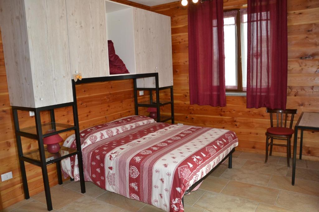 Postel nebo postele na pokoji v ubytování B&B L'albero e le stelle