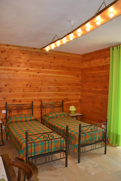 Postel nebo postele na pokoji v ubytování B&B L'albero e le stelle