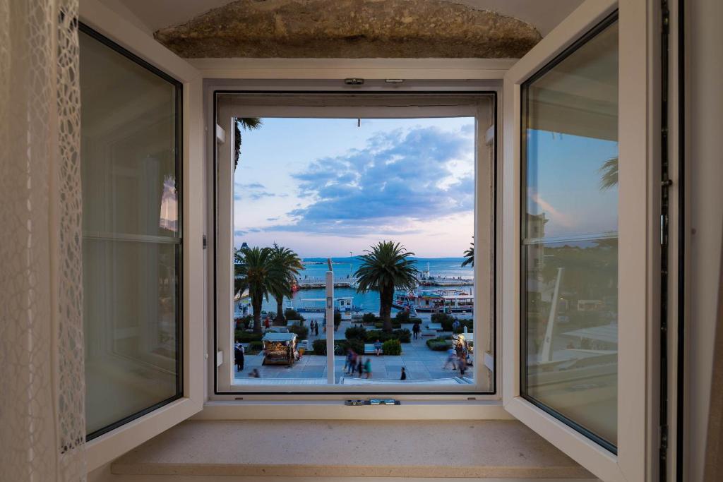 a window with a view of the ocean at Guest House Imperial in Split