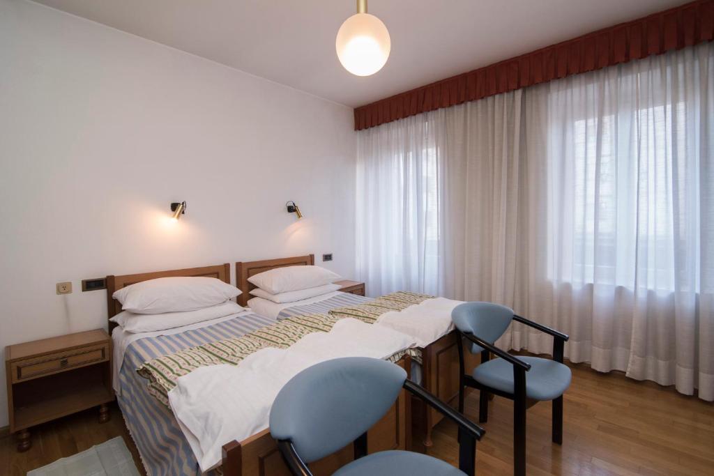 Postel nebo postele na pokoji v ubytování Al Sole Hotel Ristorante dal 1870