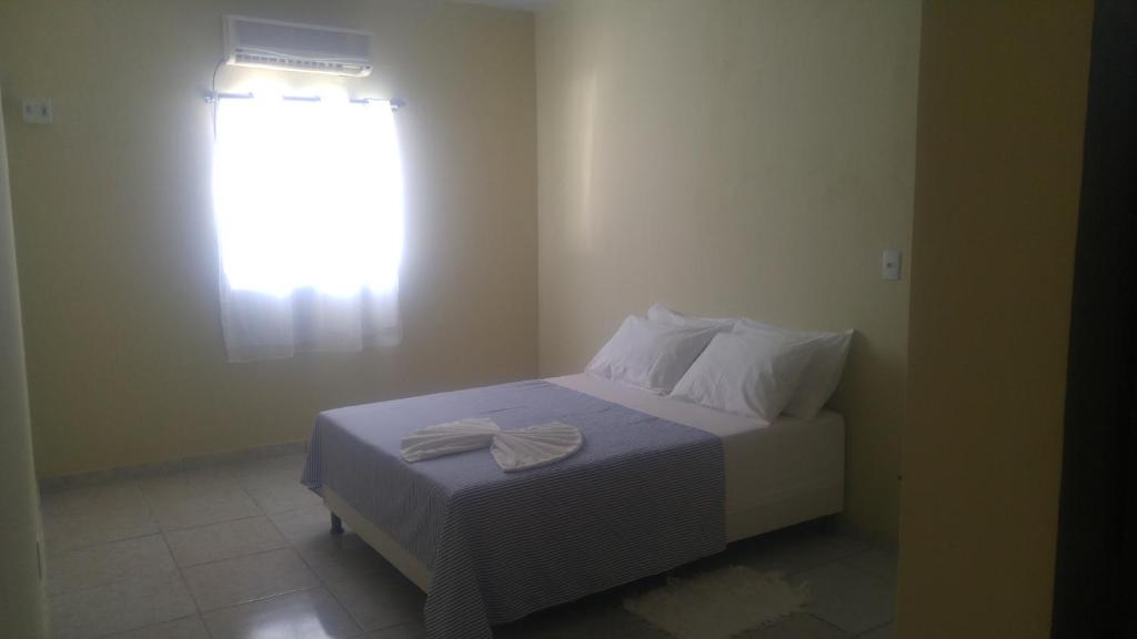 Cama ou camas em um quarto em Pousada Nordestina