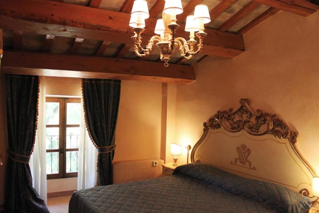 Postel nebo postele na pokoji v ubytování Villa Rinalducci