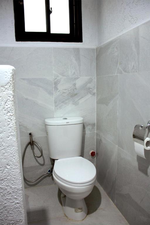 Koupelna v ubytování Sentro Suites Siargao