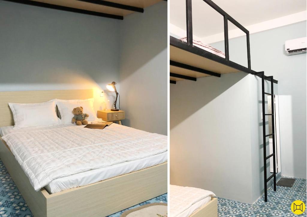 ein Schlafzimmer mit einem Hochbett und einer Treppe in der Unterkunft Alley Quy Nhon Homestay in Quy Nhon