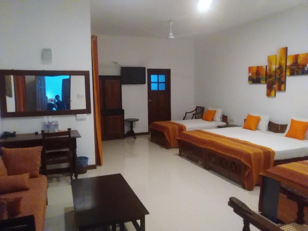 Postel nebo postele na pokoji v ubytování Hotel Sunflower