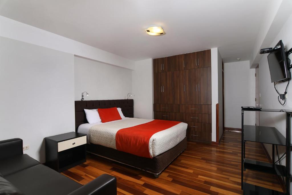 Кровать или кровати в номере Residencial Emilio