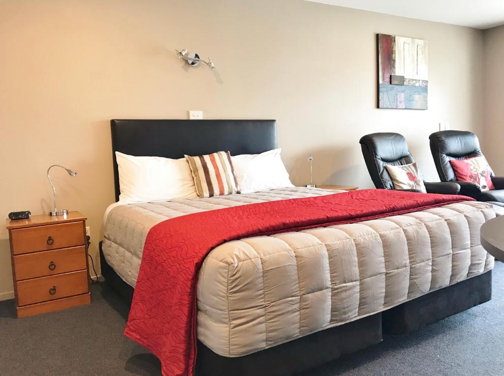 Postel nebo postele na pokoji v ubytování Phoenix Motels
