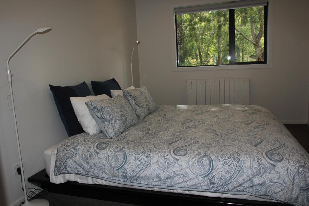 Letto o letti in una camera di Korepo Lodge @ Ruby Bay