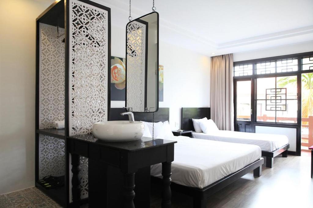 Postel nebo postele na pokoji v ubytování Thanh Binh 2 Hotel