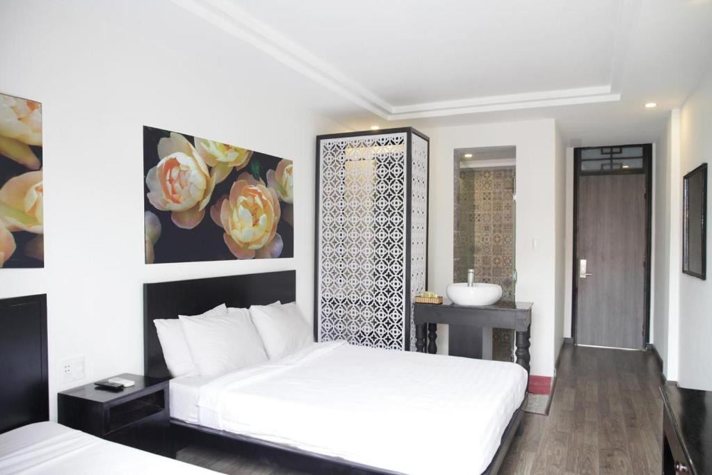 Postel nebo postele na pokoji v ubytování Thanh Binh 2 Hotel