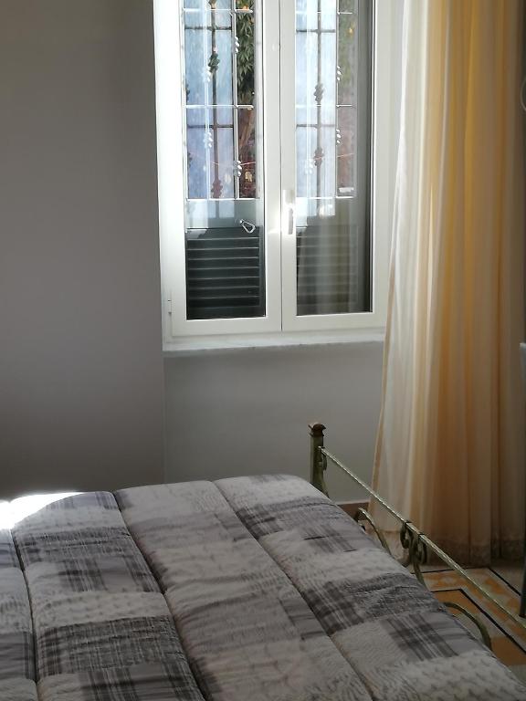 Postel nebo postele na pokoji v ubytování B&B Enjoy Ercolano