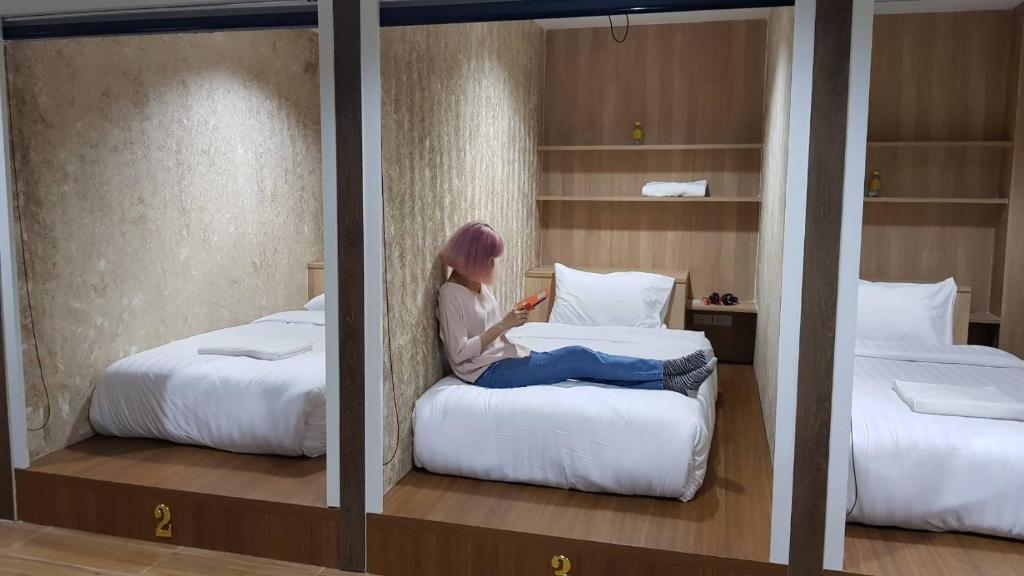 Postel nebo postele na pokoji v ubytování Baan Wanchart