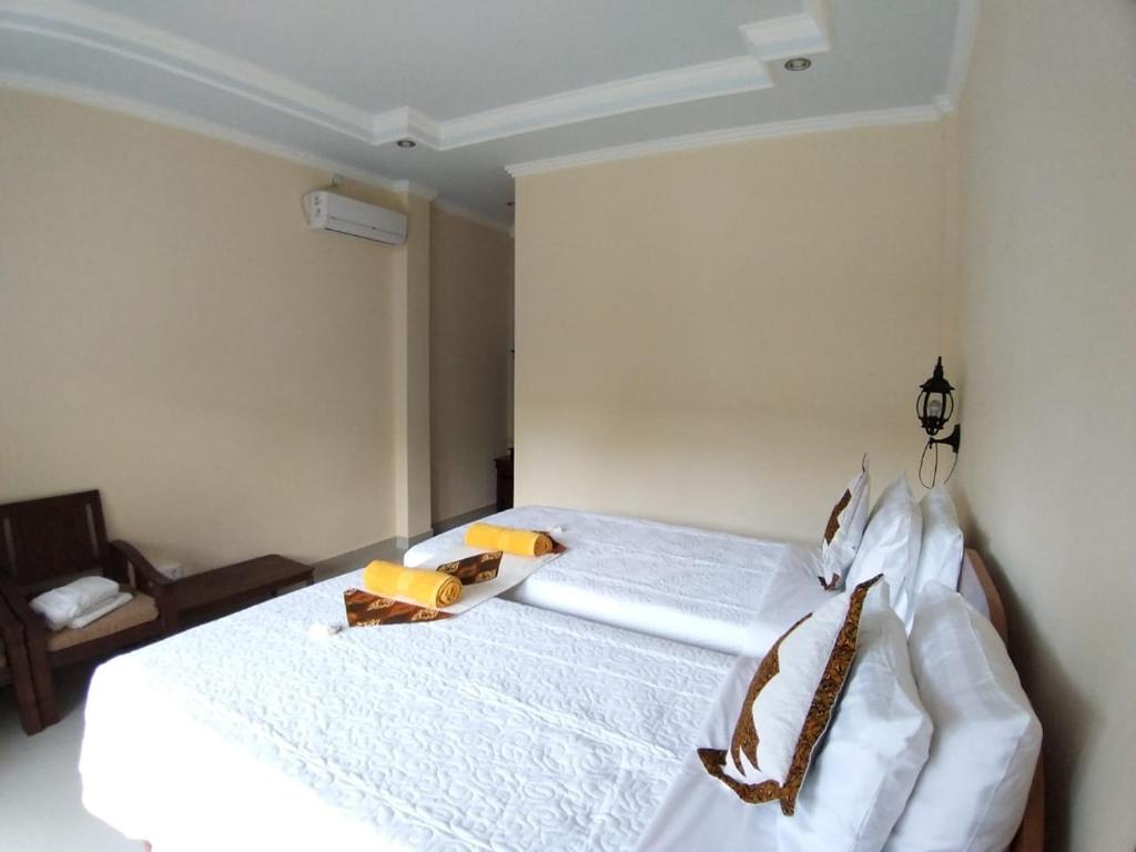 Postel nebo postele na pokoji v ubytování Muka House