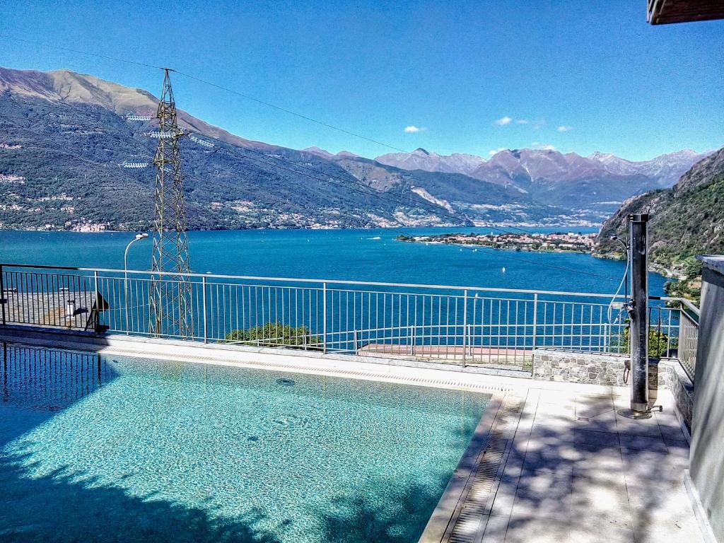 a swimming pool with a view of the water at LA VISTA by Design Studio in Bellano