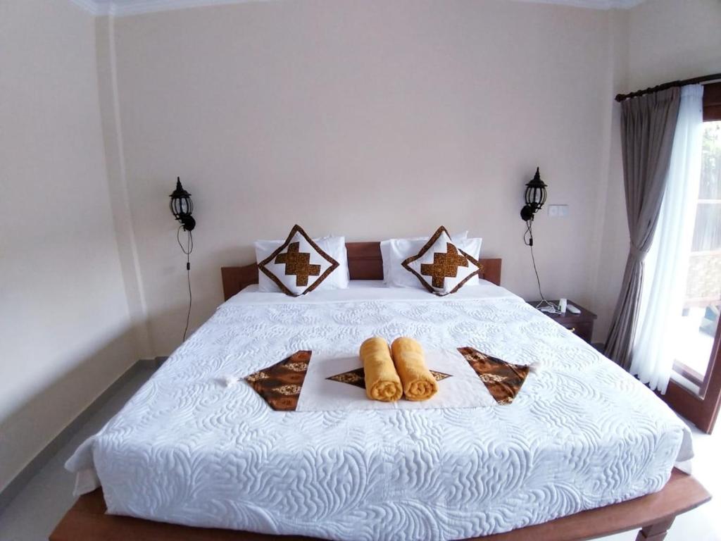 Postel nebo postele na pokoji v ubytování Muka House
