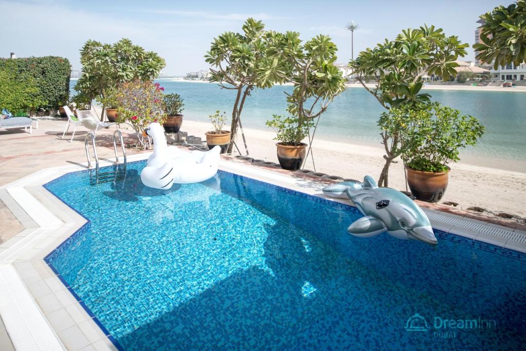The swimming pool at or near Dream Inn - Royal Palm Beach Villa