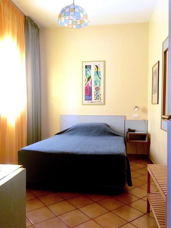 Postel nebo postele na pokoji v ubytování Hotel Ping Pong