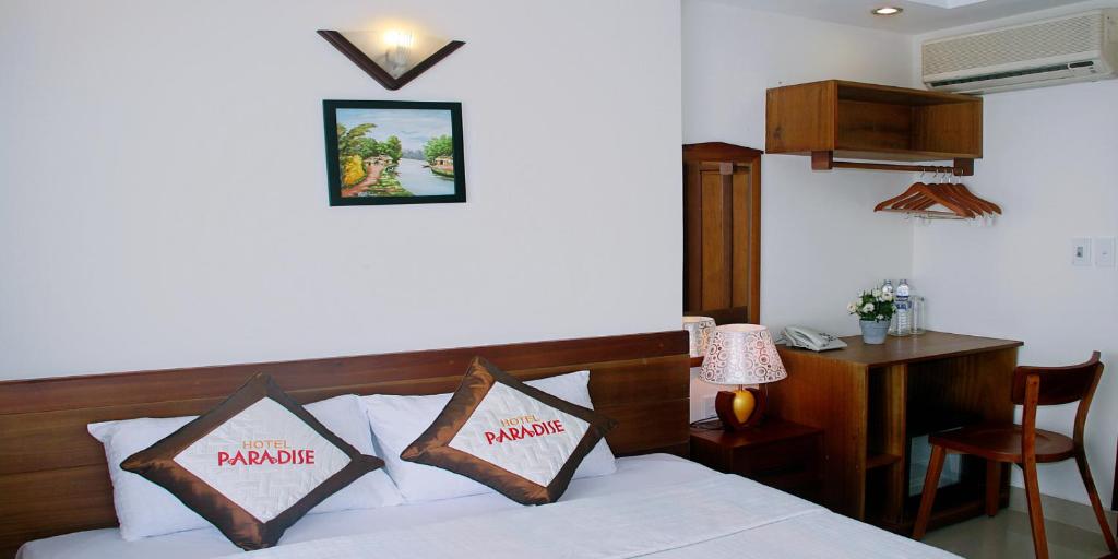 Postel nebo postele na pokoji v ubytování Paradise Hotel