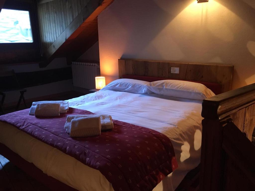 A bed or beds in a room at maison terme relax