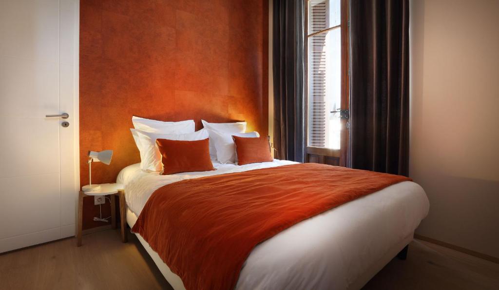 A bed or beds in a room at Villa Saint Enogat