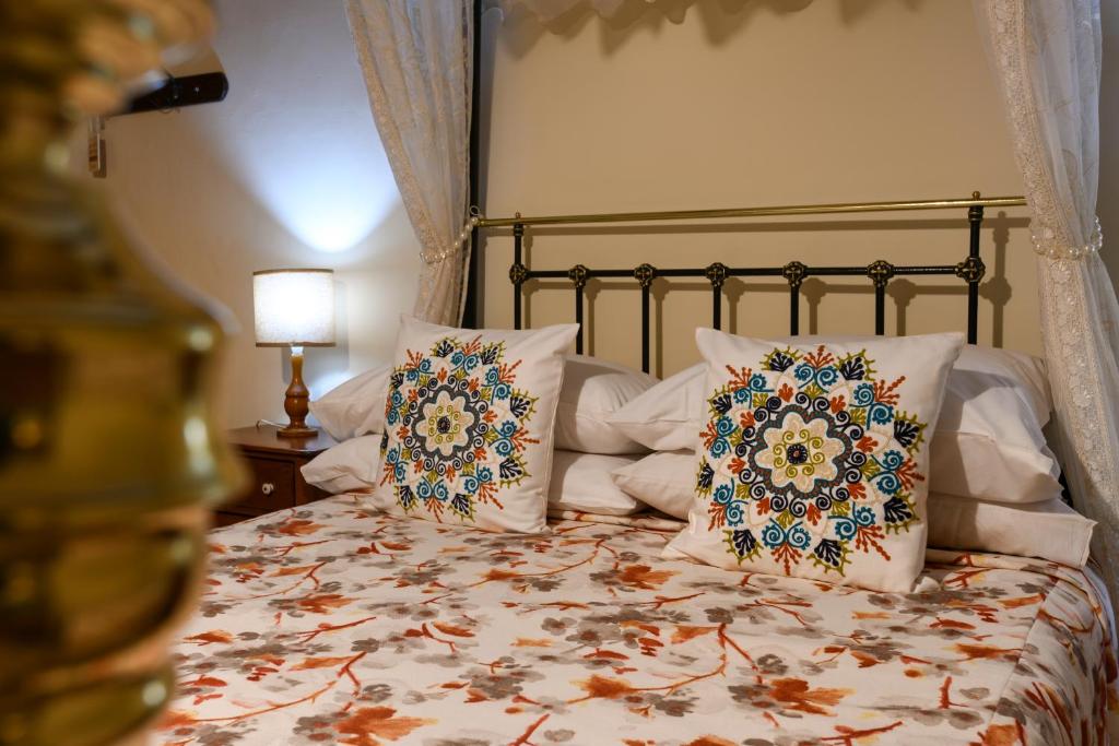 Ein Bett oder Betten in einem Zimmer der Unterkunft Maria Giovanna Guest House